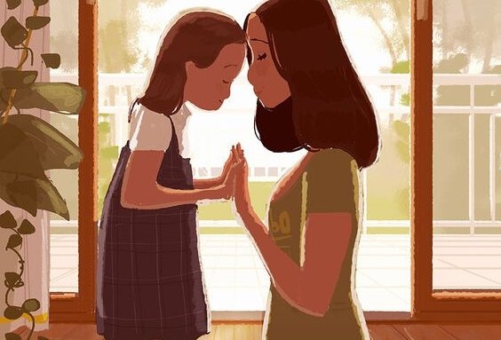 Mama i córka dotykające się czołami