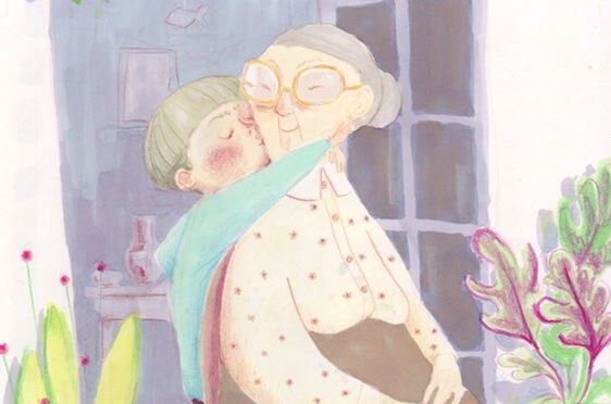 Wnuczek przytulający i całujący babcię
