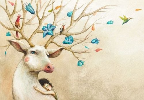 Dziecko, które tuli się do renifera - uczenie dziecka