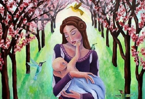 Mama trzyma w ramionach dziecko