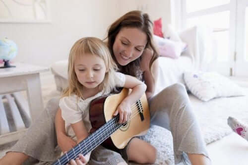 Dziecko gra na gitarze